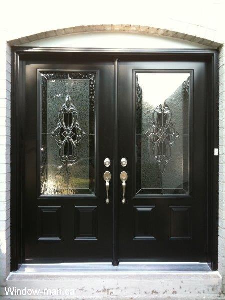 Double Black front doors installation. Front entry insulated. Three quarters glass. Classic stained glass collection. Round top flashing capping above